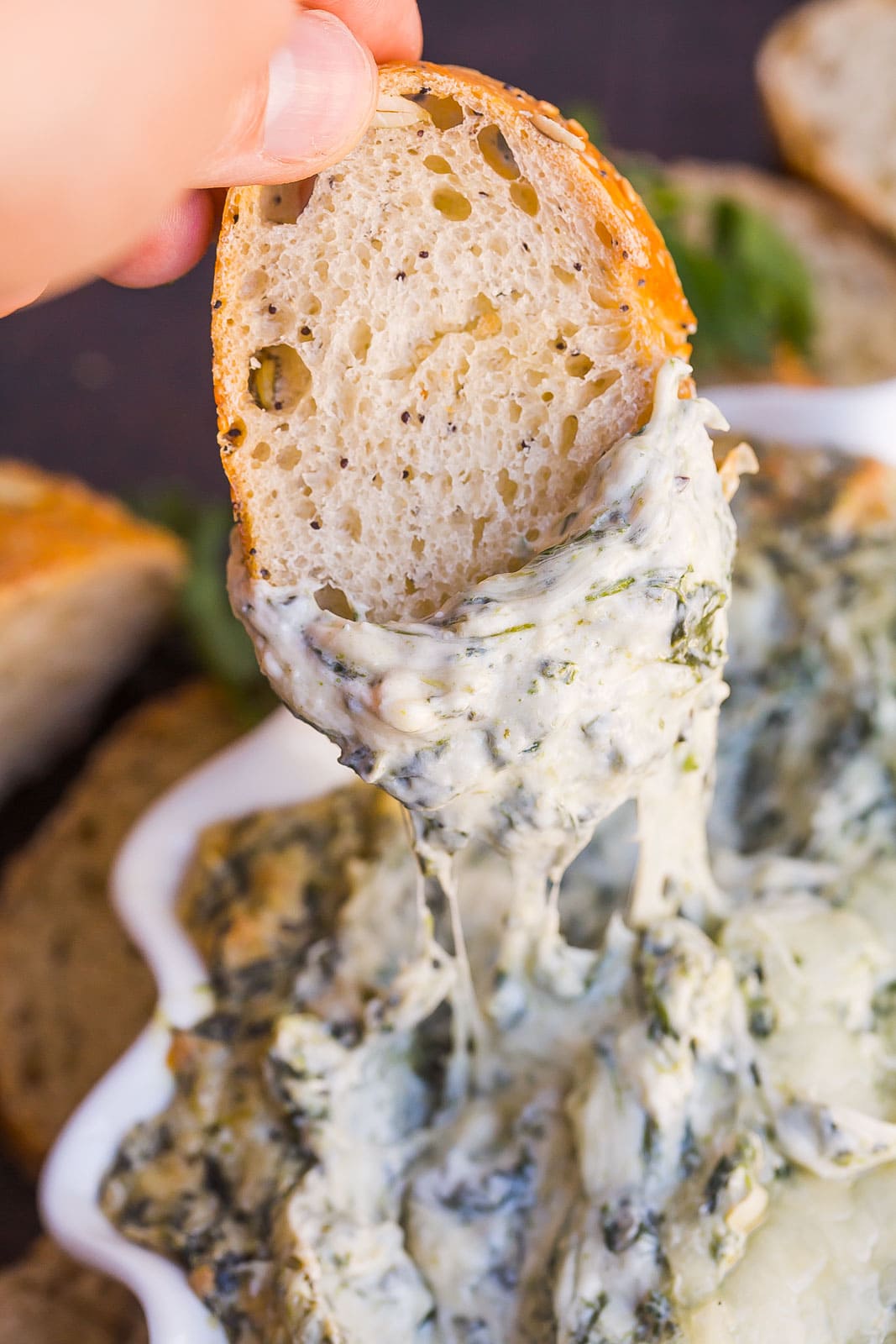 Cheese pull of bread and spinach dip.