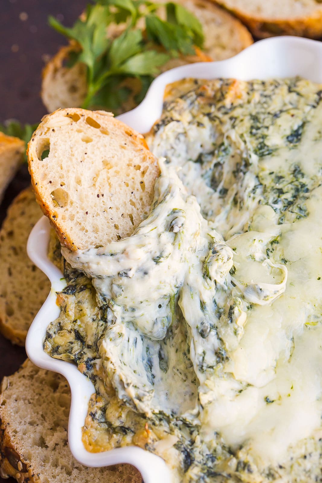 Cheesy spinach dip with bread. 
