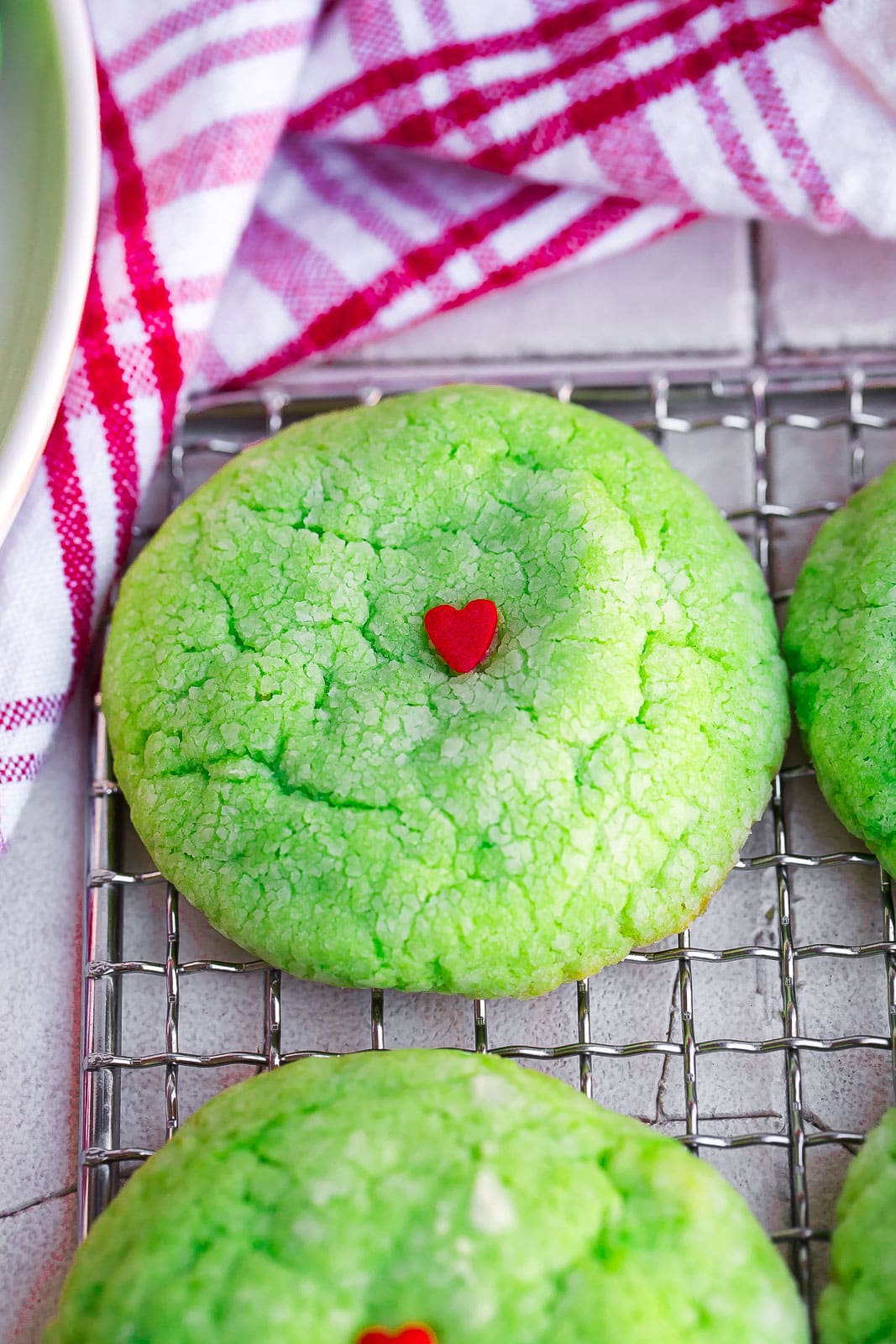 Grinch cake mix cookies on a cooling rack.