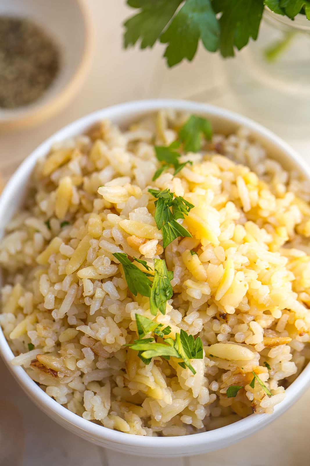 Rice pilaf in a white bowl.