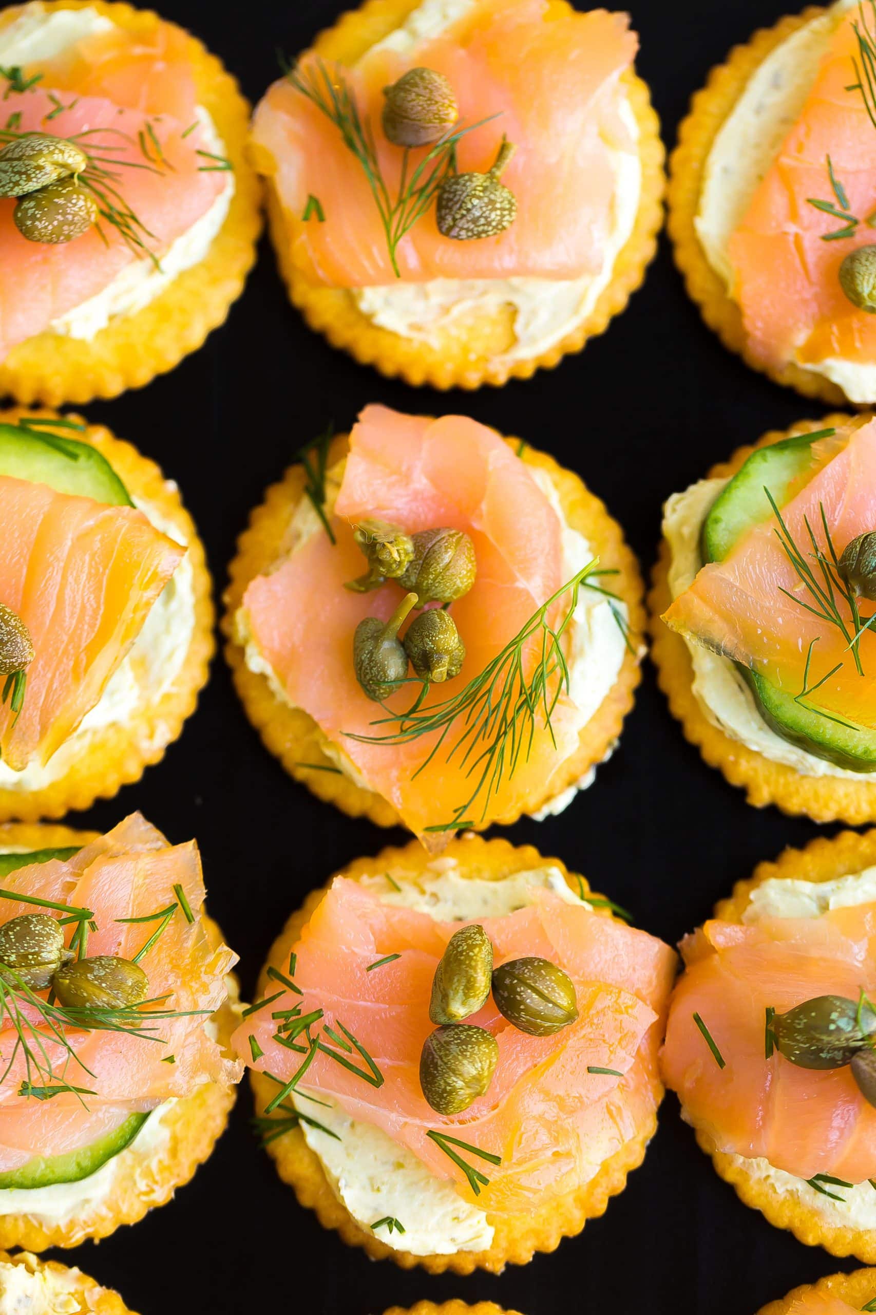 Close up view of smoked salmon on crackers. 