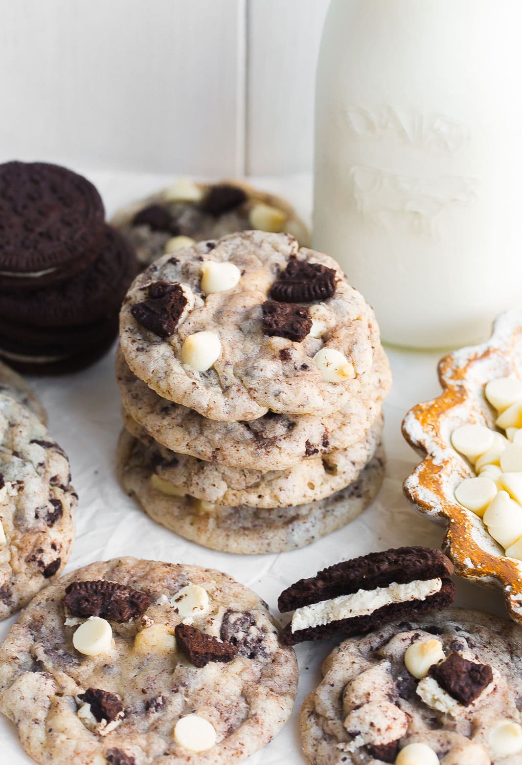 Short stack of cookies and cream cookies with milk.