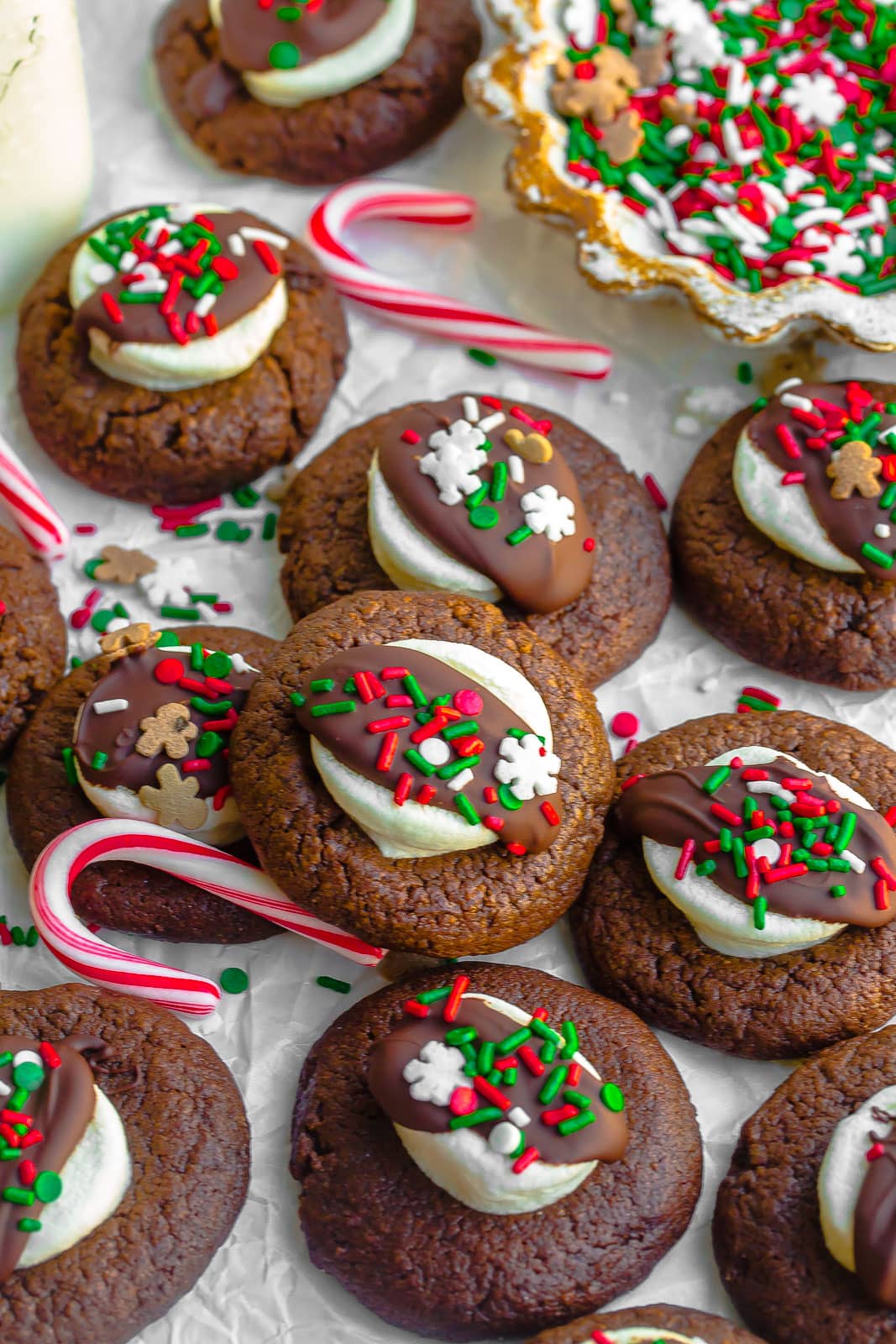 Hot cocoa cookies with sprinkles, marshmallows, sprinkles, and candy canes.