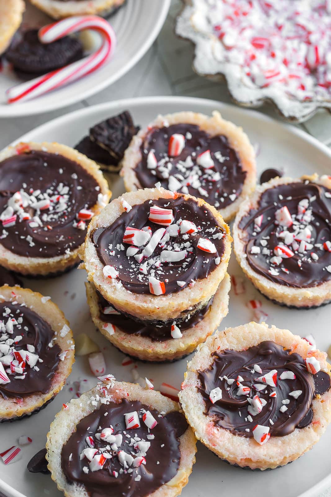 Peppermint Bark Cheesecake Bites on a white plate. 