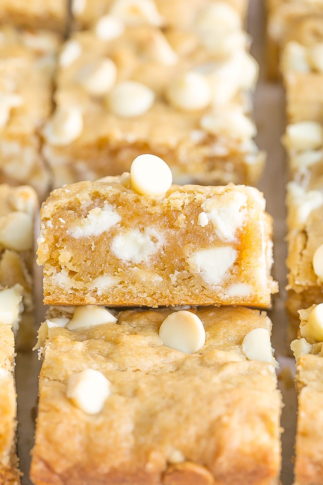 Side view of the inside of a white chocolate blondie.