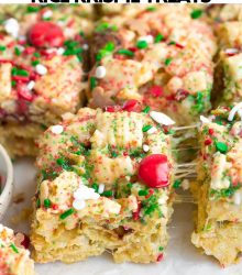 Gooey rice krispie treat with Christmas sprinkles and candies.