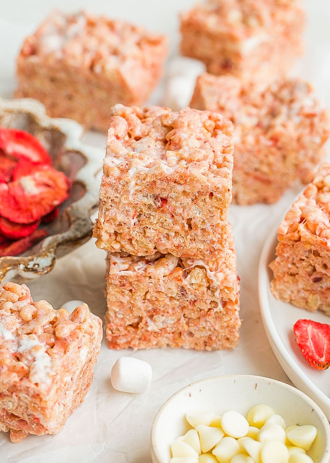 Strawberry Rice Krispie Treats stacked on top of each-other. 
