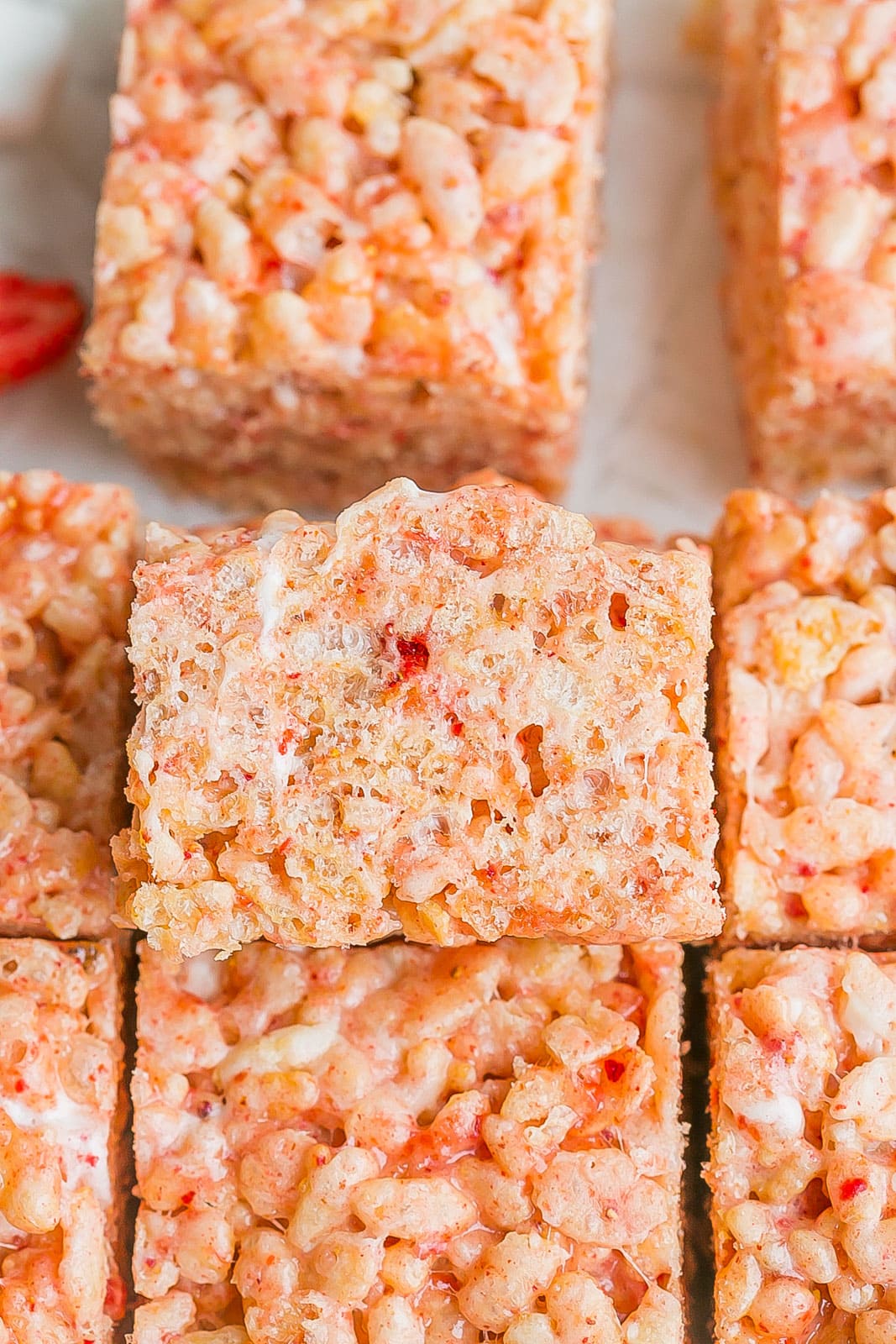 Close up side view of pink rice Krispie treat. 