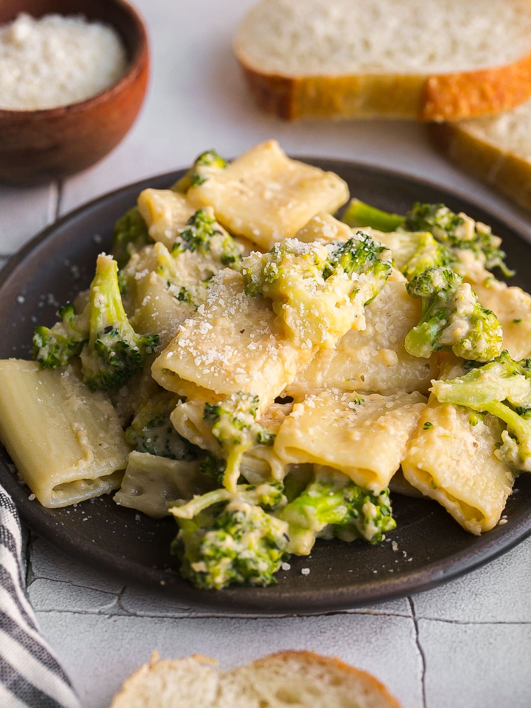 Pasta with cheesy sauce and broccoli florets. 