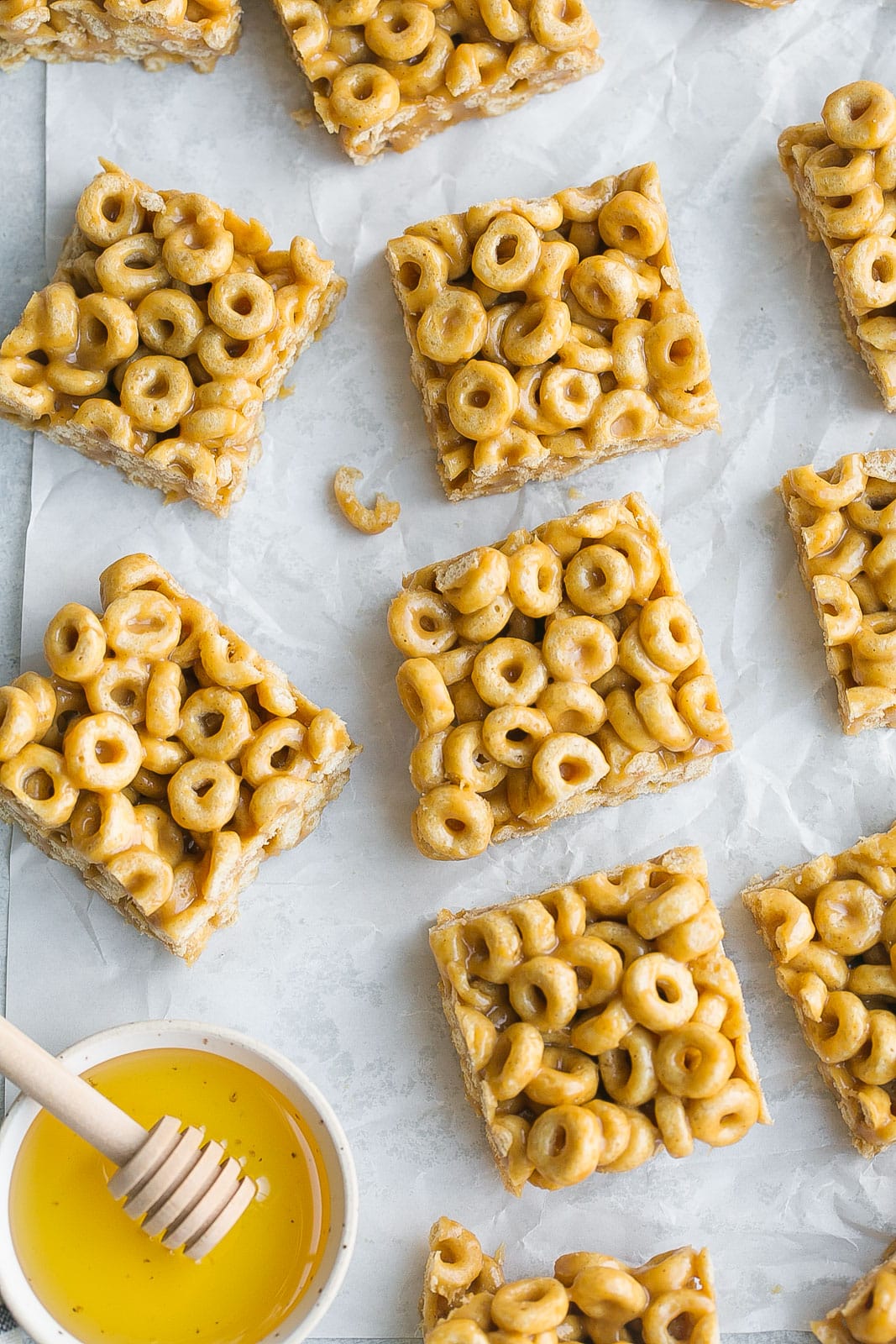 Cheerio treat Bars on parchment paper.