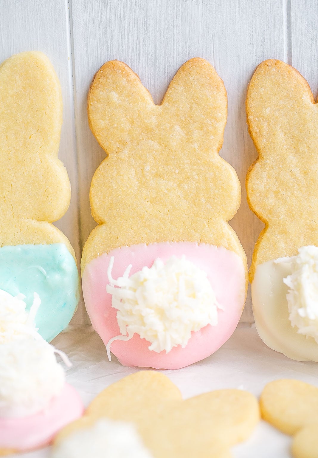 Pink, blue, and white dipped bunny cookies.