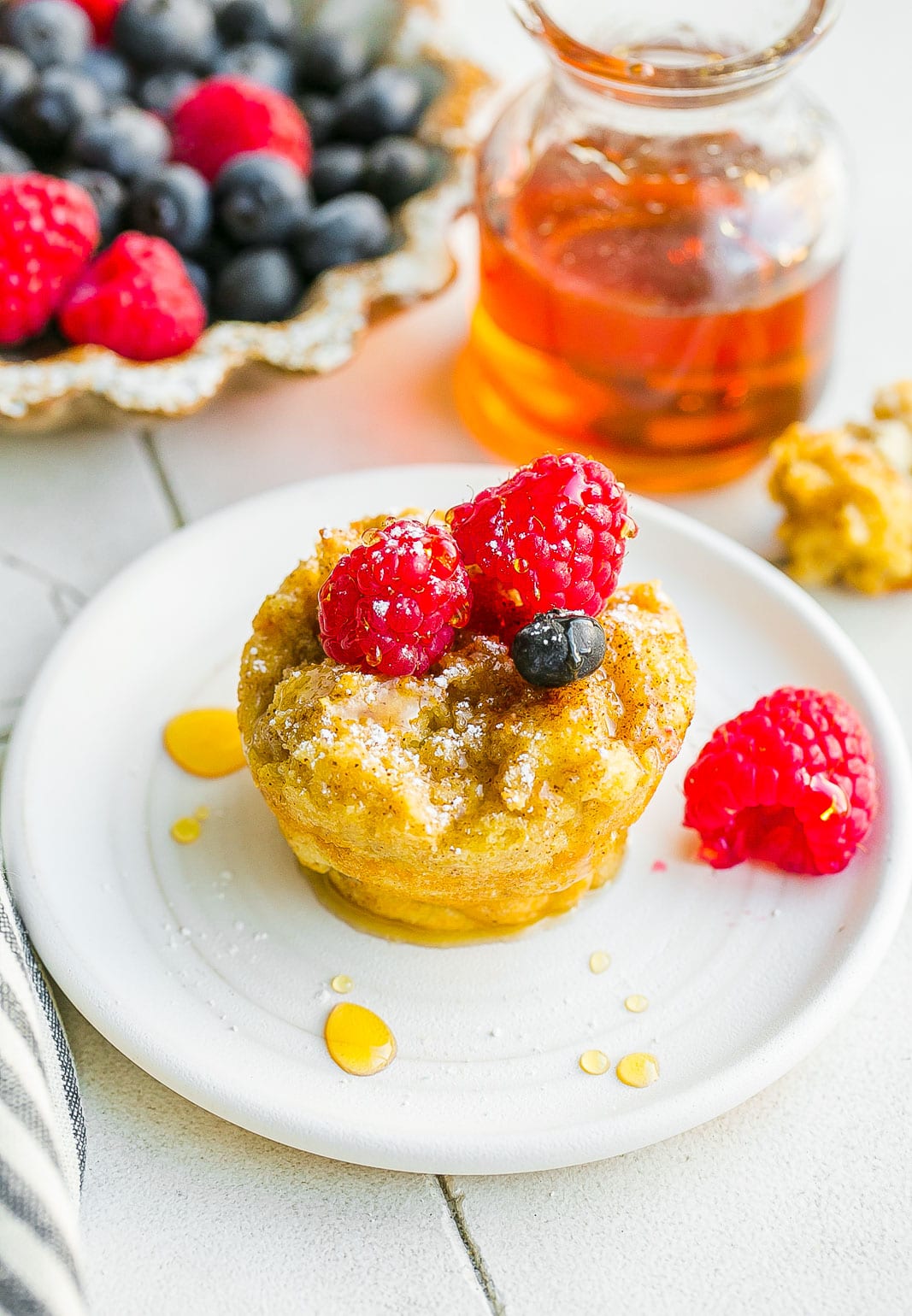 Breakfast muffin with maple syrup on top.