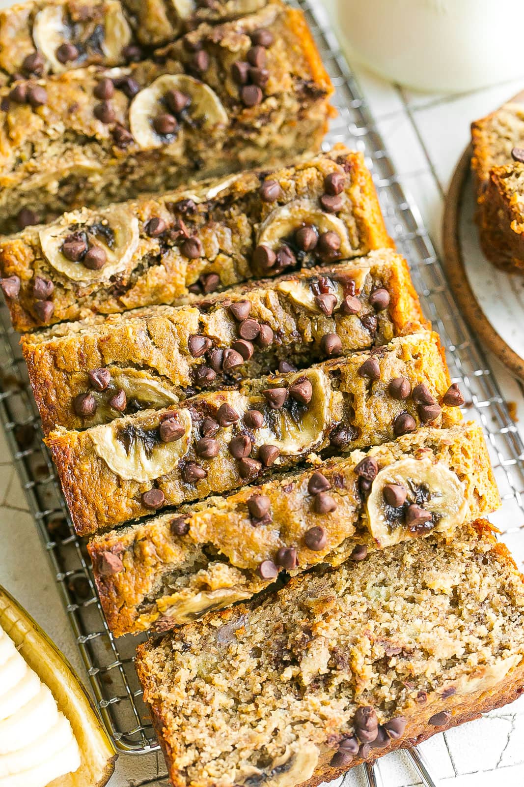 Sliced bread with bananas and chocolate chips.