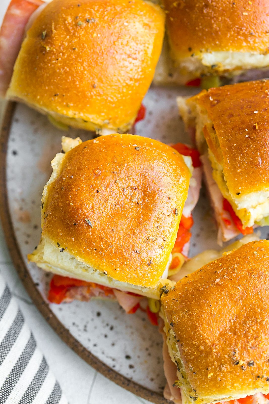 Baked sliders with Italian meats and cheeses. 