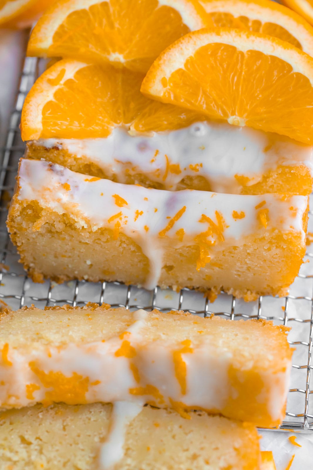 Orange Loaf Cake with sliced orange on top.
