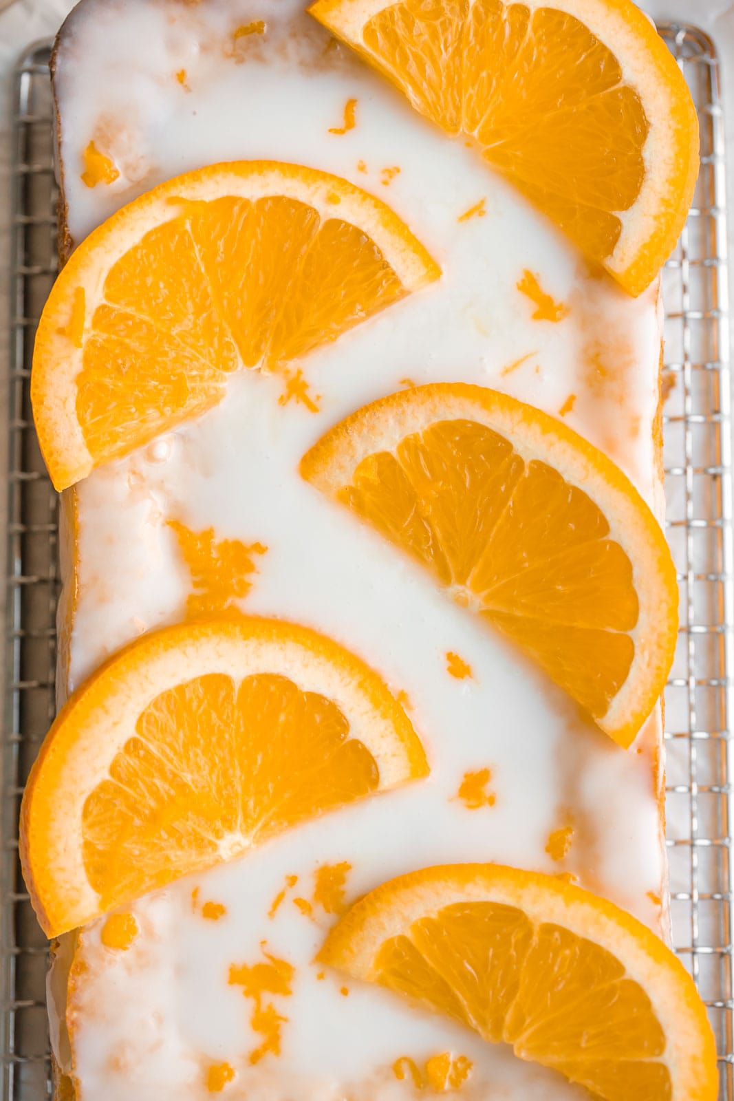 Close up view of iced orange cake. 