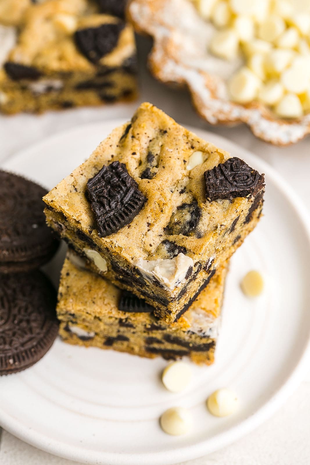 Oreo cookie bars on a white plate.