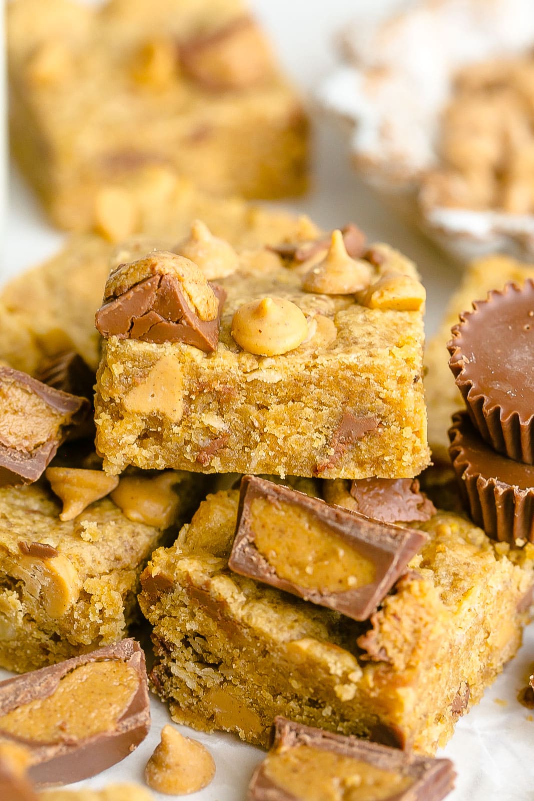 Side view of a cookie bar with peanut butter cups.