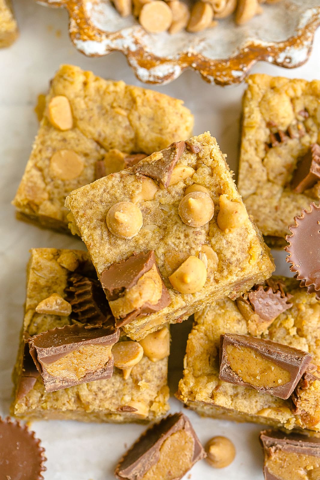 Cookie bars with Reese's peanut butter cups and peanut butter chips.