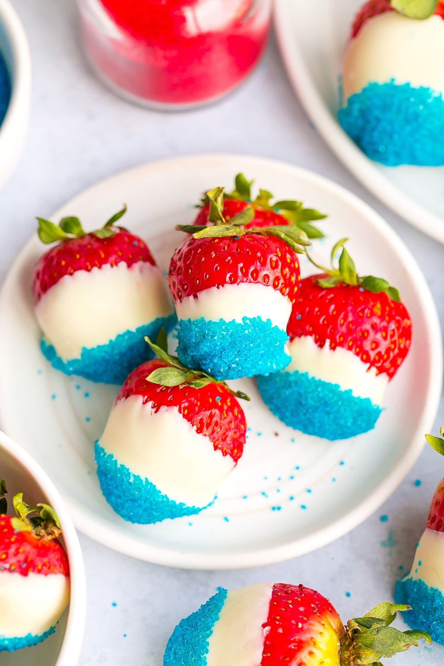 Patriotic strawberries on a white plate.