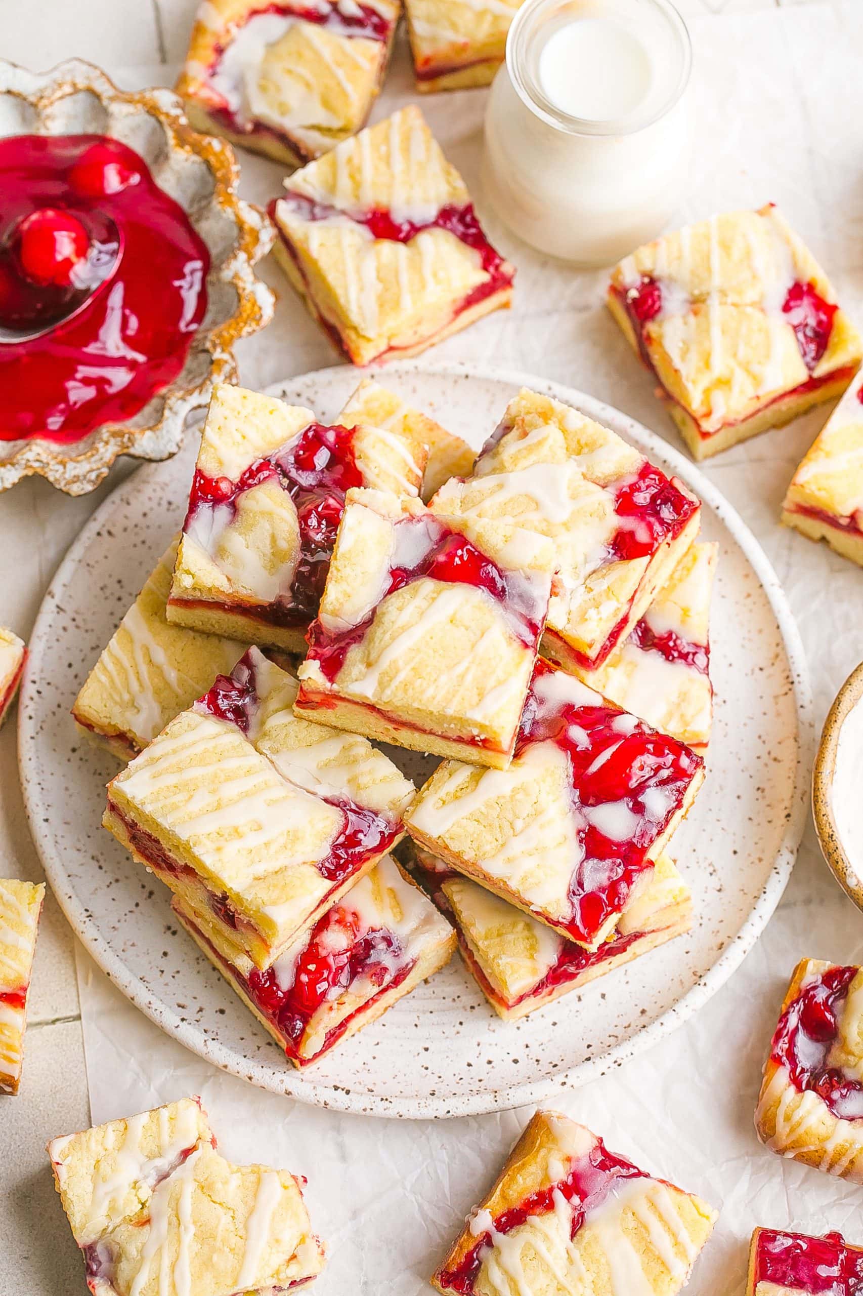 Iced pie bars with cherry filling.