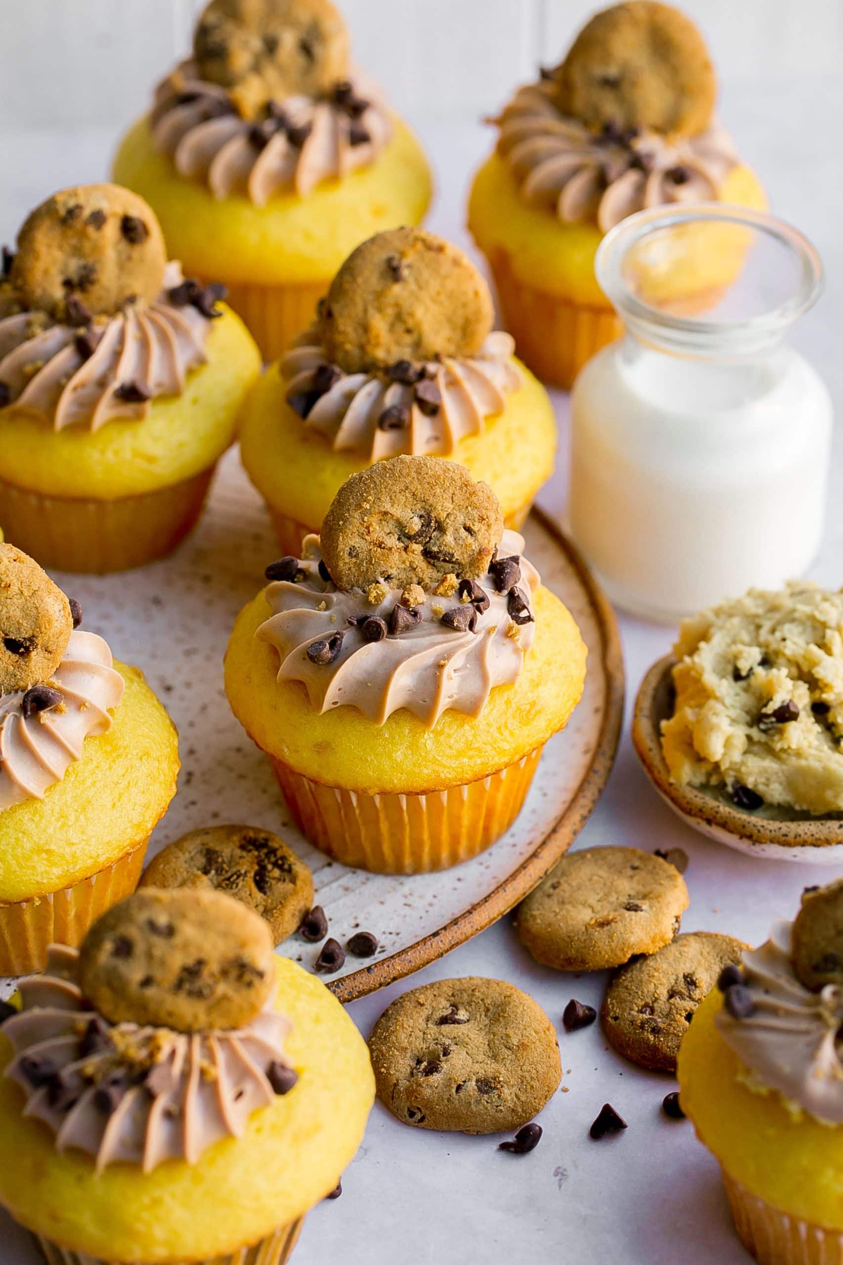 Cookie dough cupcakes on a plate.