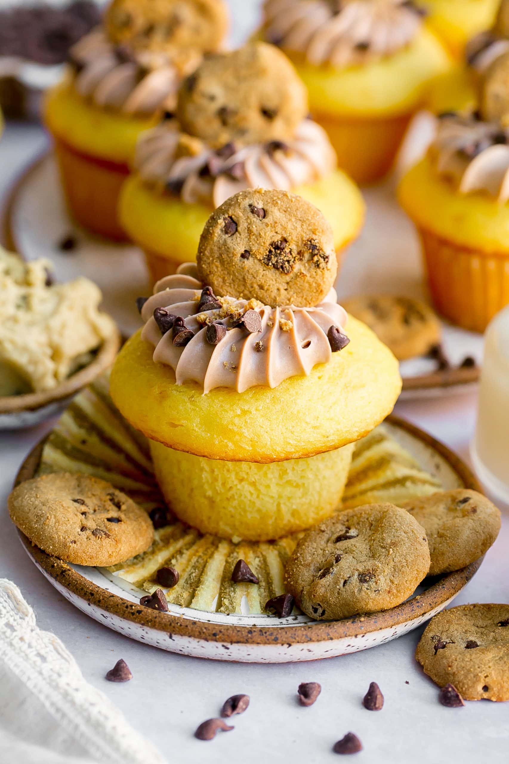Cupcakes with chocolate frosting and mini cookie on top.