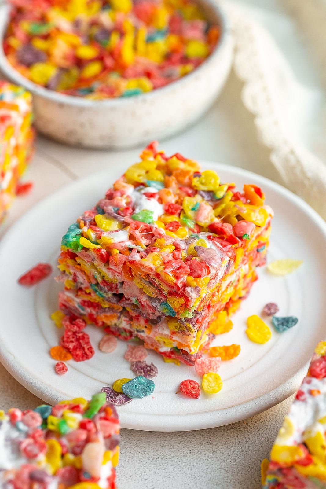 Fruity Pebbles Marshmallow Treats
on a white plate.