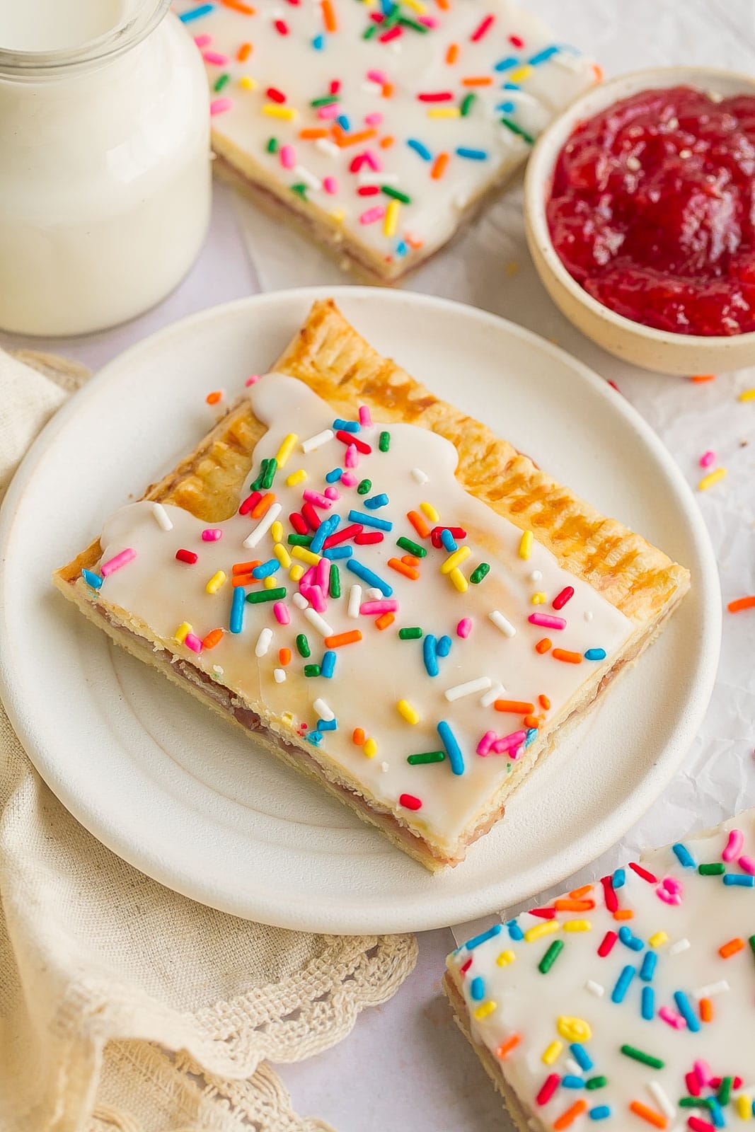 Piece of homemade pop tart on a small white plate. 