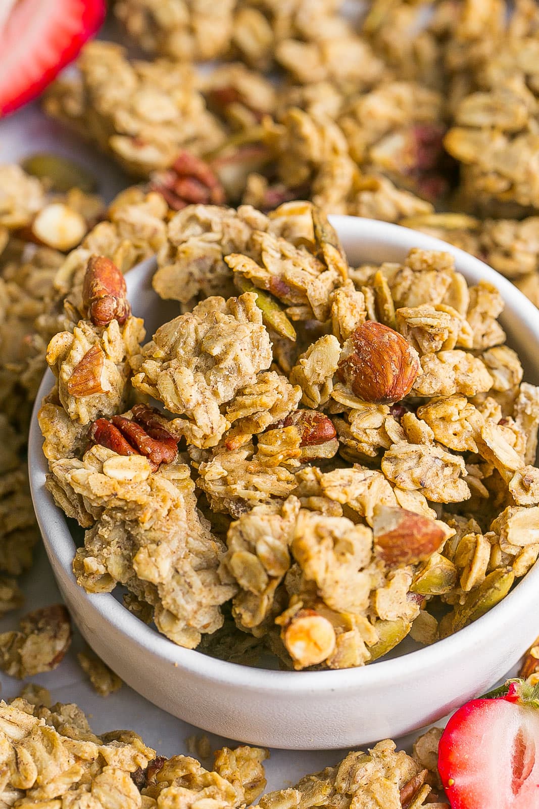 Close up view of chunky protein granola in a bowl.