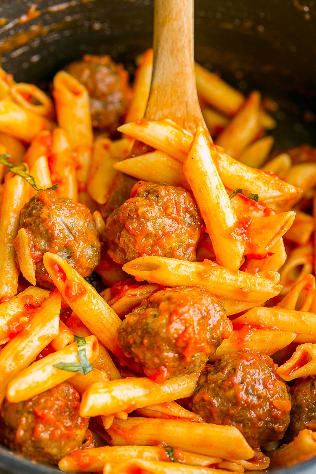 Close up of pasta and meatballs.