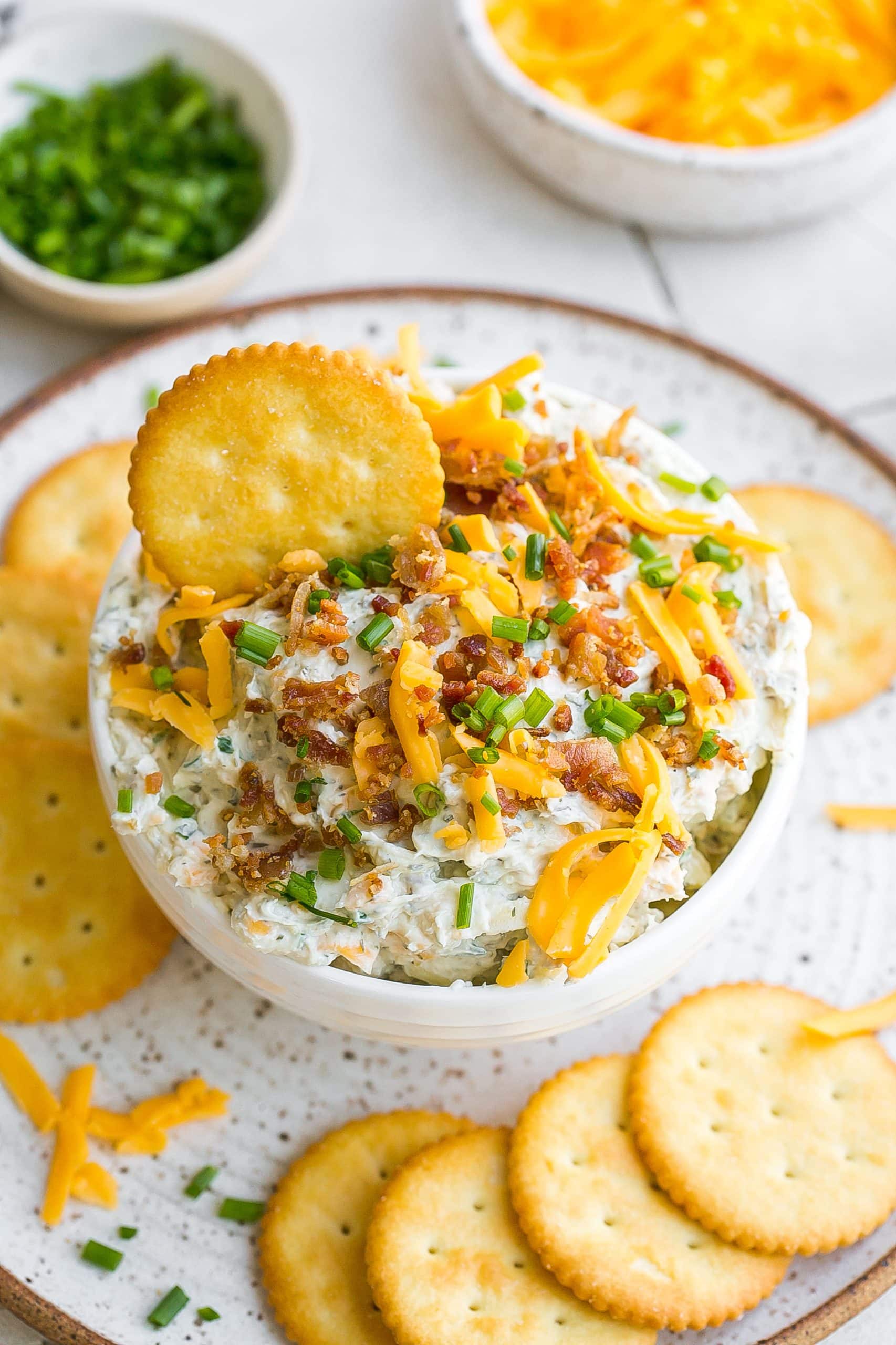 Crack Dip in a white bowl with crackers. 