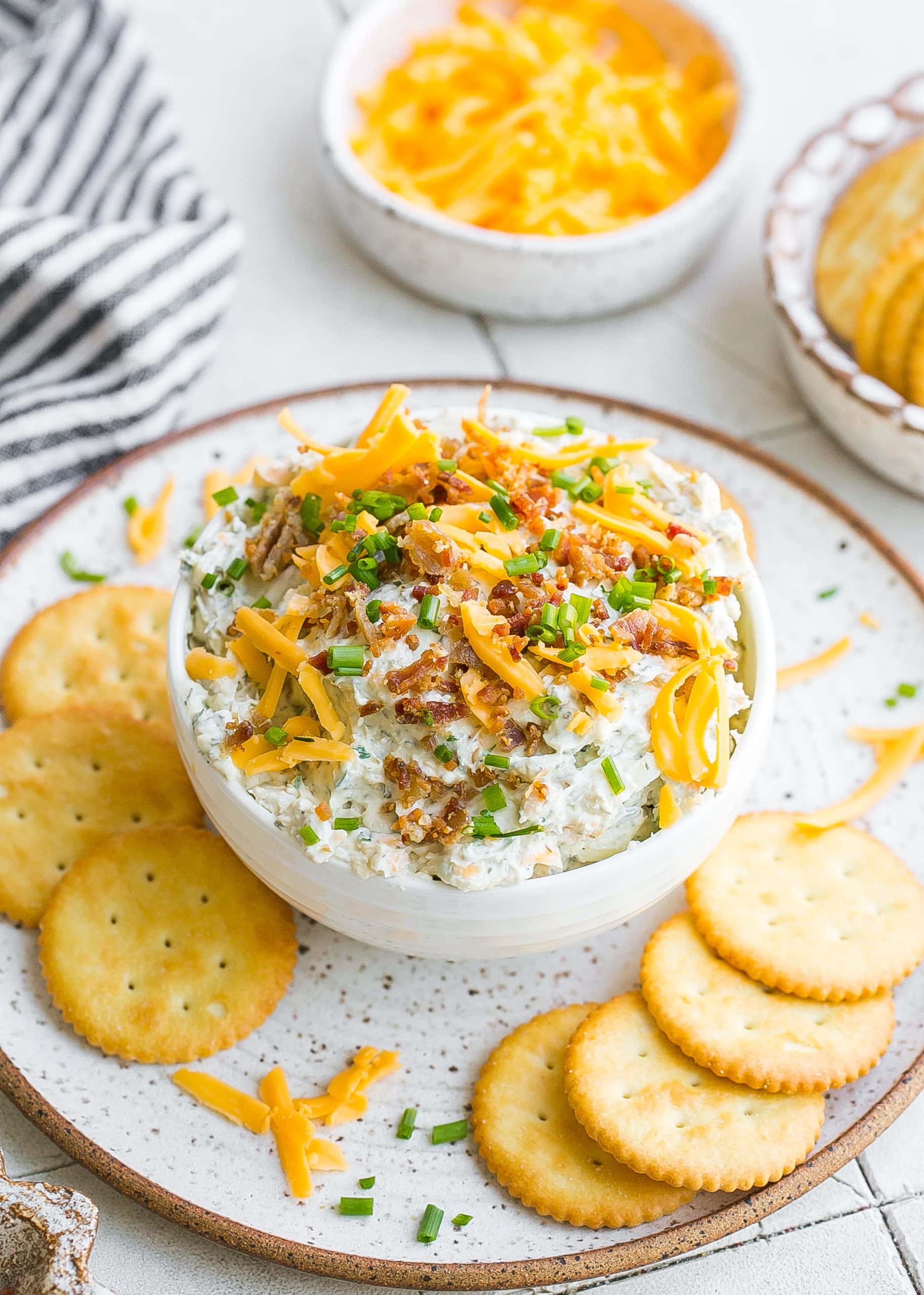 Ranch dip in bowl with crackers. 