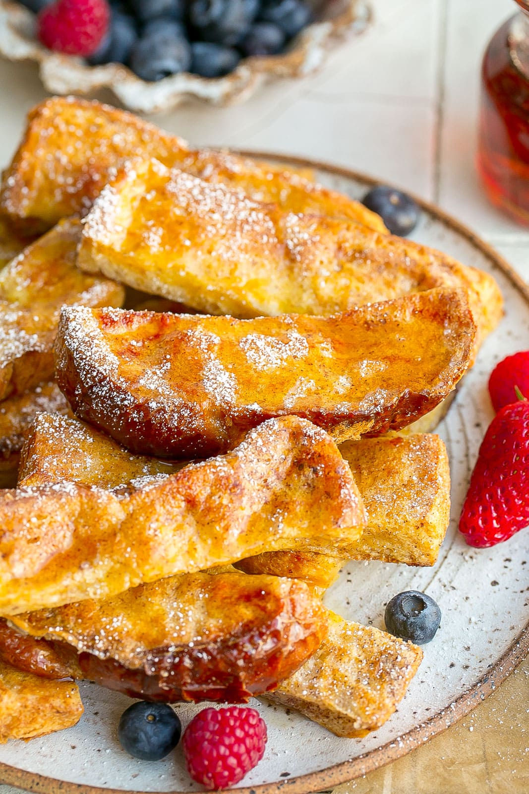 French Toast Sticks with powdered sugar on top.