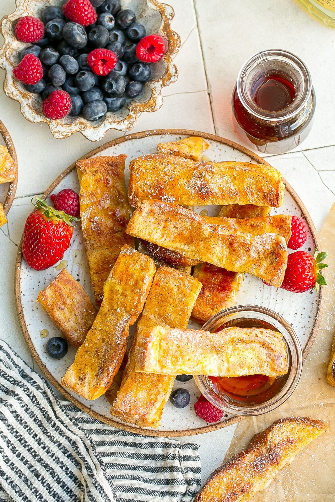 Plate full of french toast sticks.