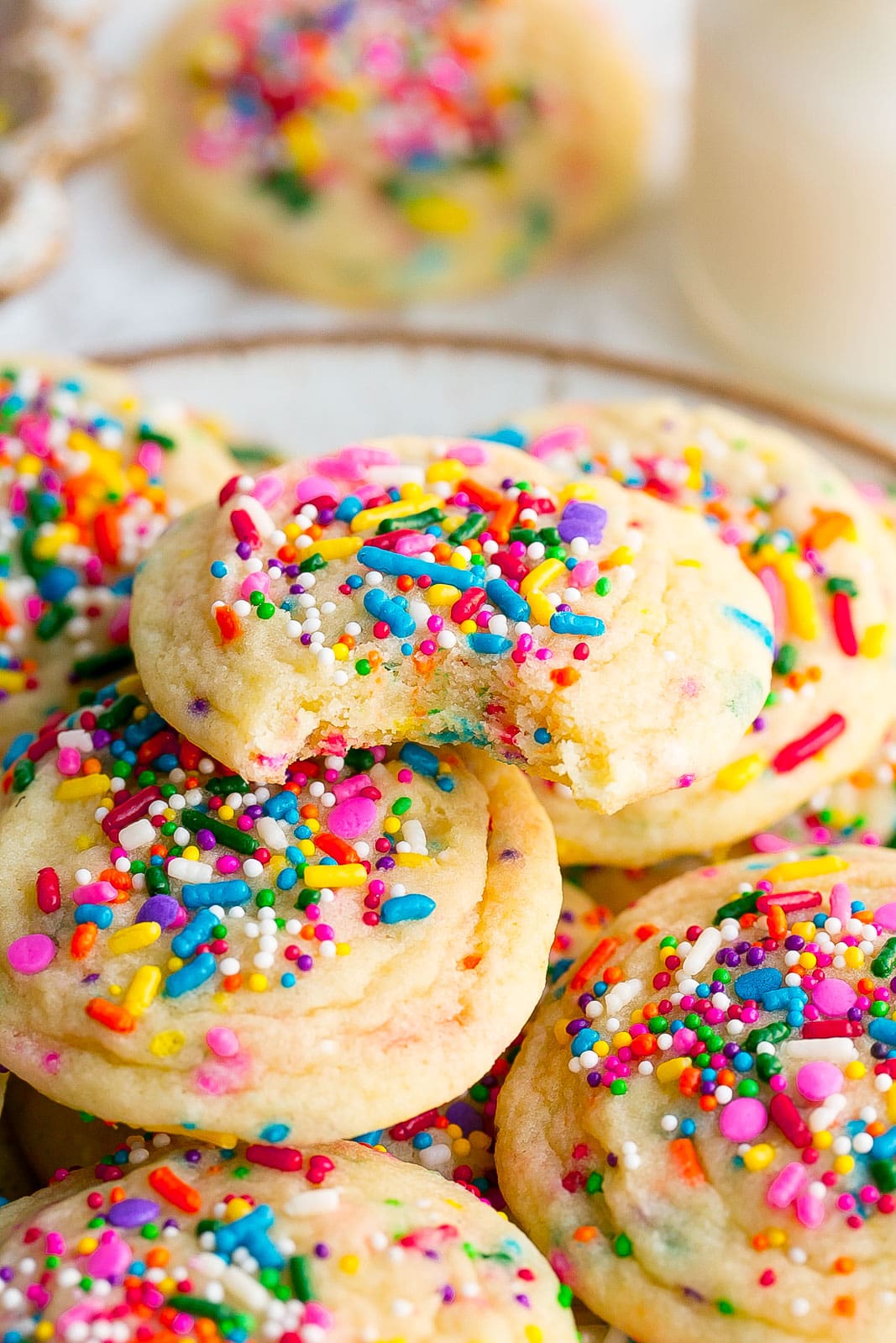 Bite mark in a cookie with sprinkles. 