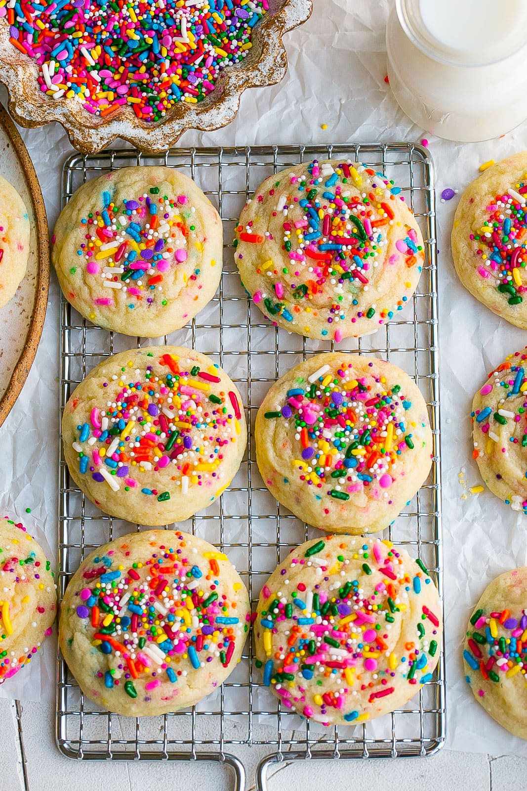Cookies with sprinkles on a cooling rack. 