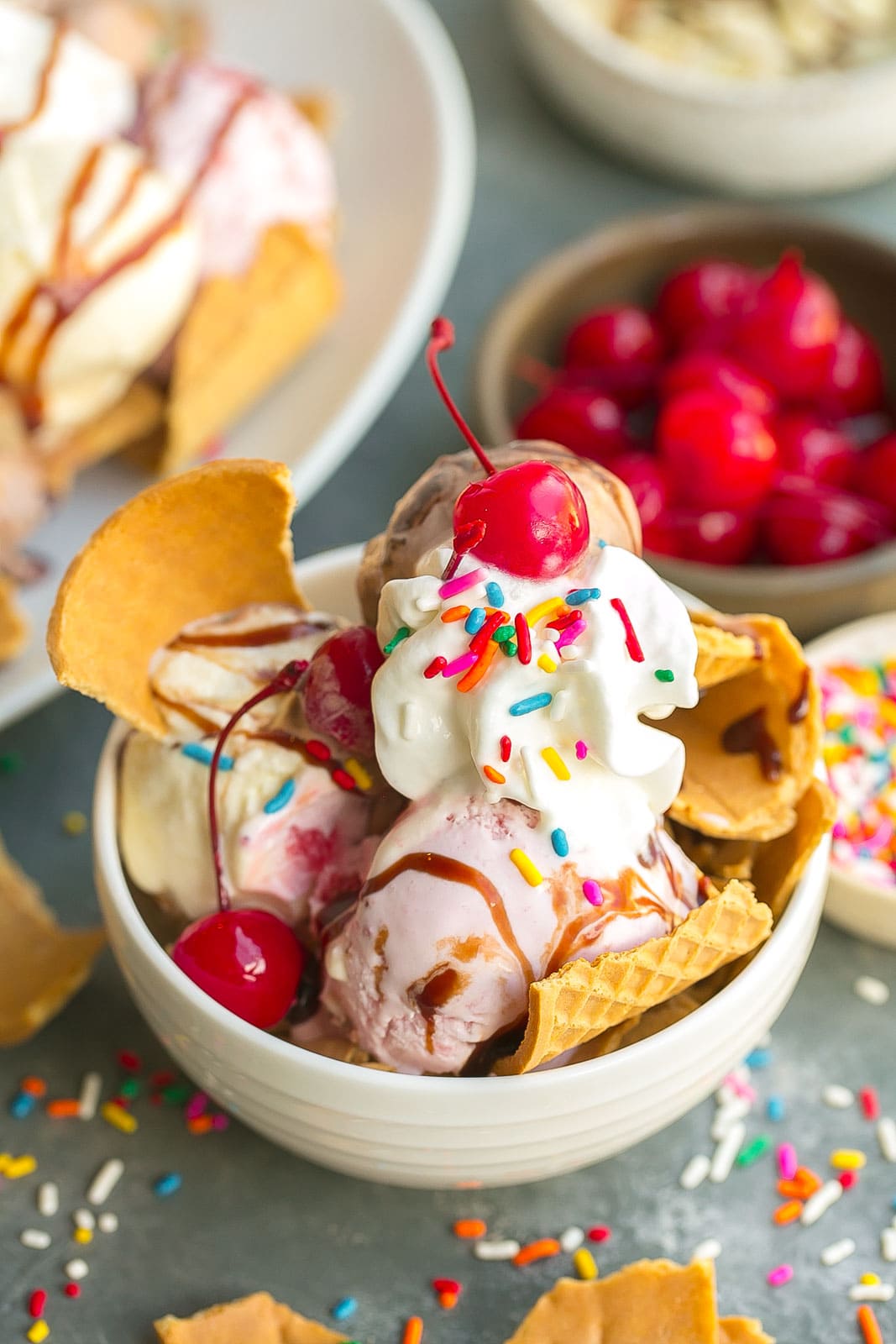 Bowl of ice cream nachos with waffle chips.