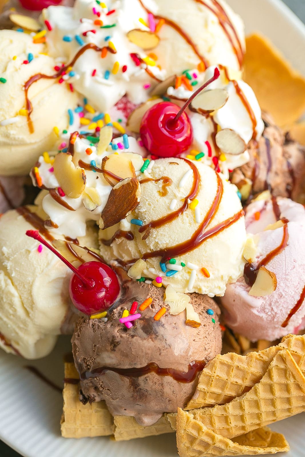 Ice cream desert with cherry on top.