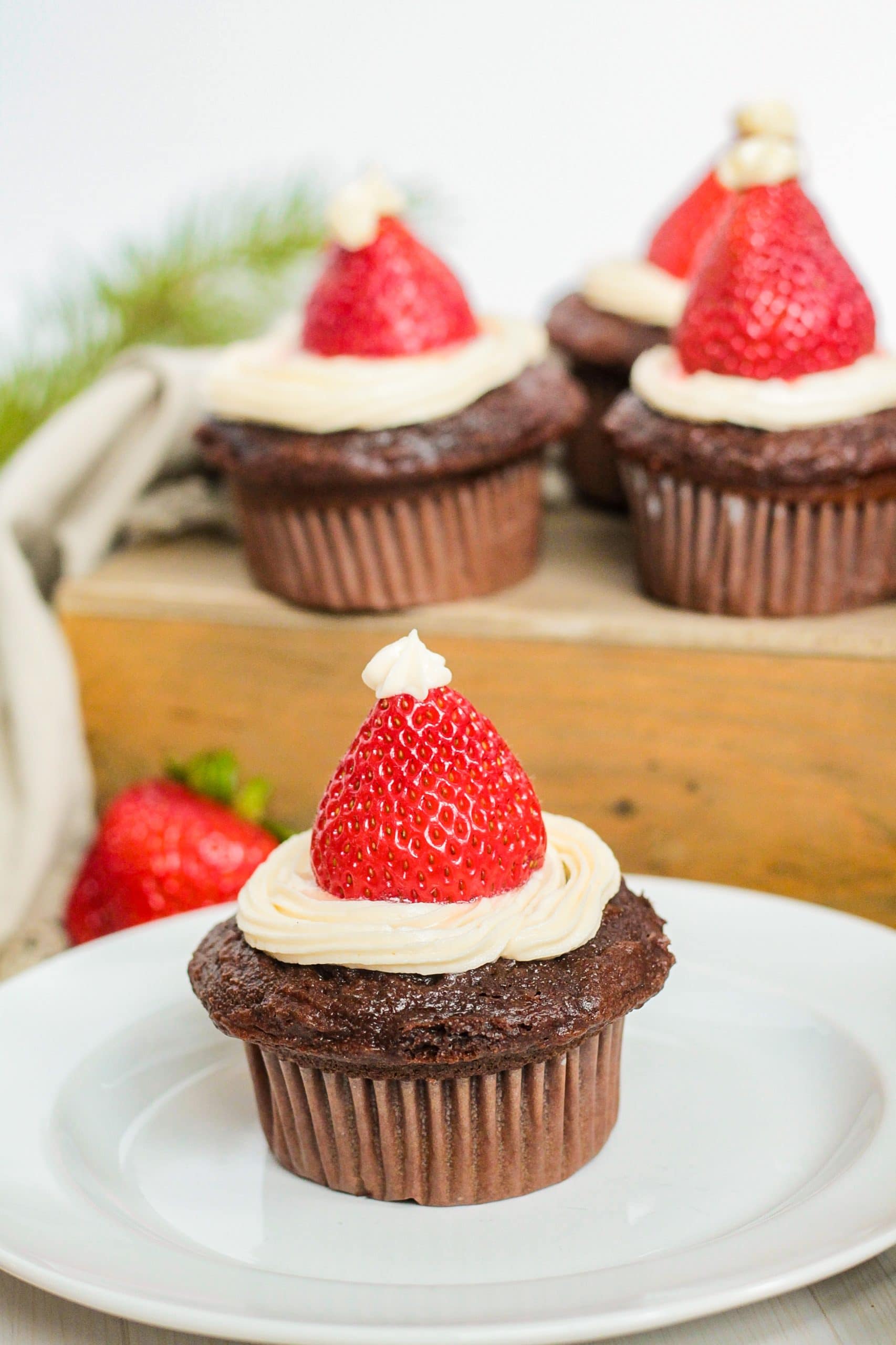 Chocolate cupcakes with strawberries.