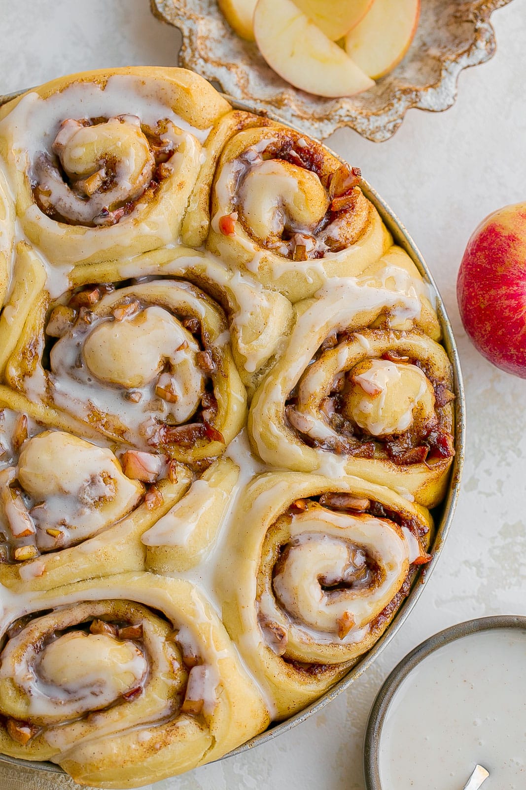 Cinnamon rolls with apple pie filling with icing. 