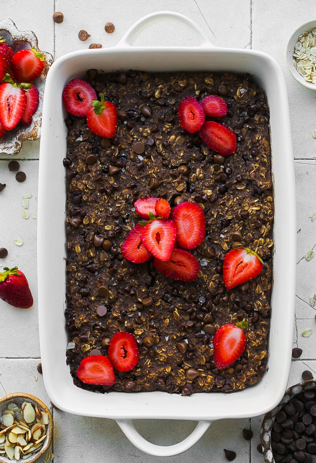 Brownie baked oatmeal with strawberries and salt on top.