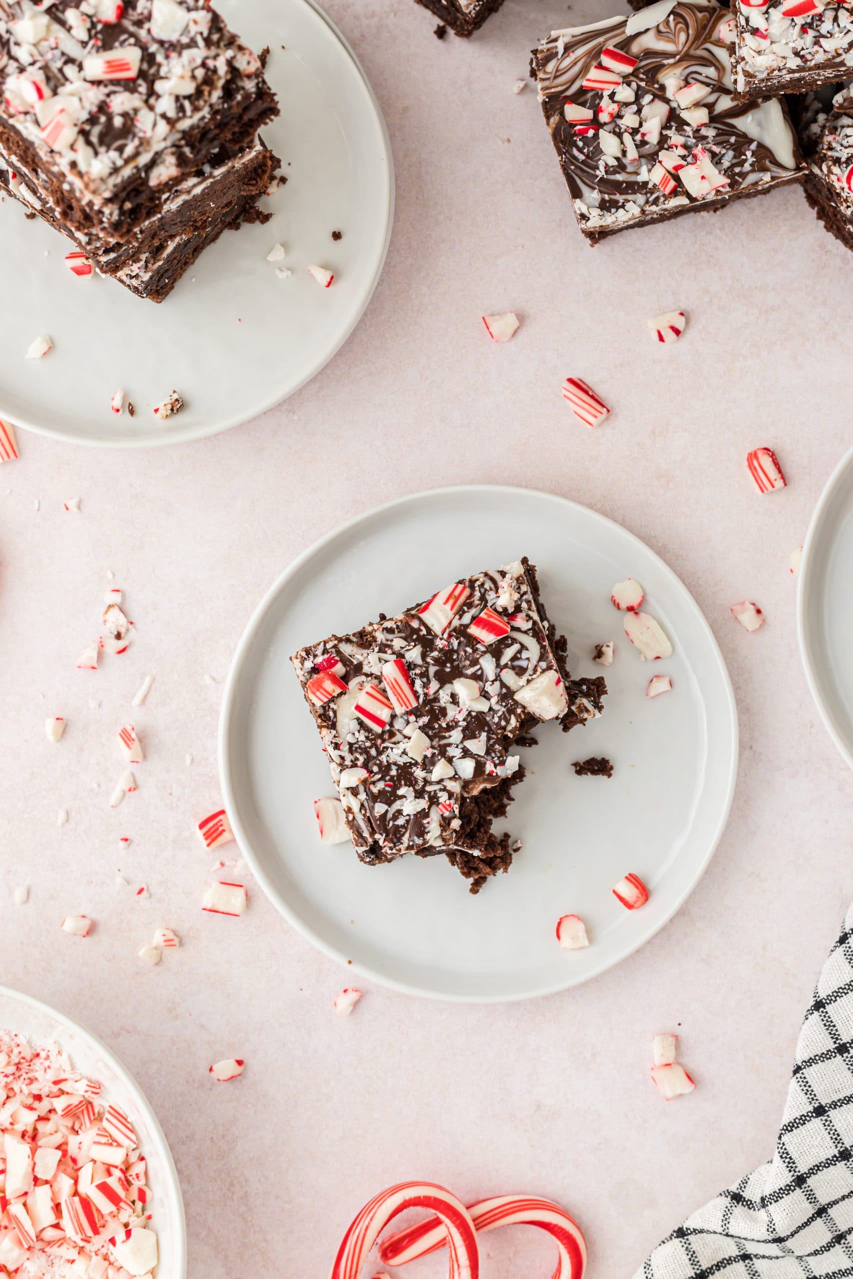 Bite of brownie with crushed candy canes on top.