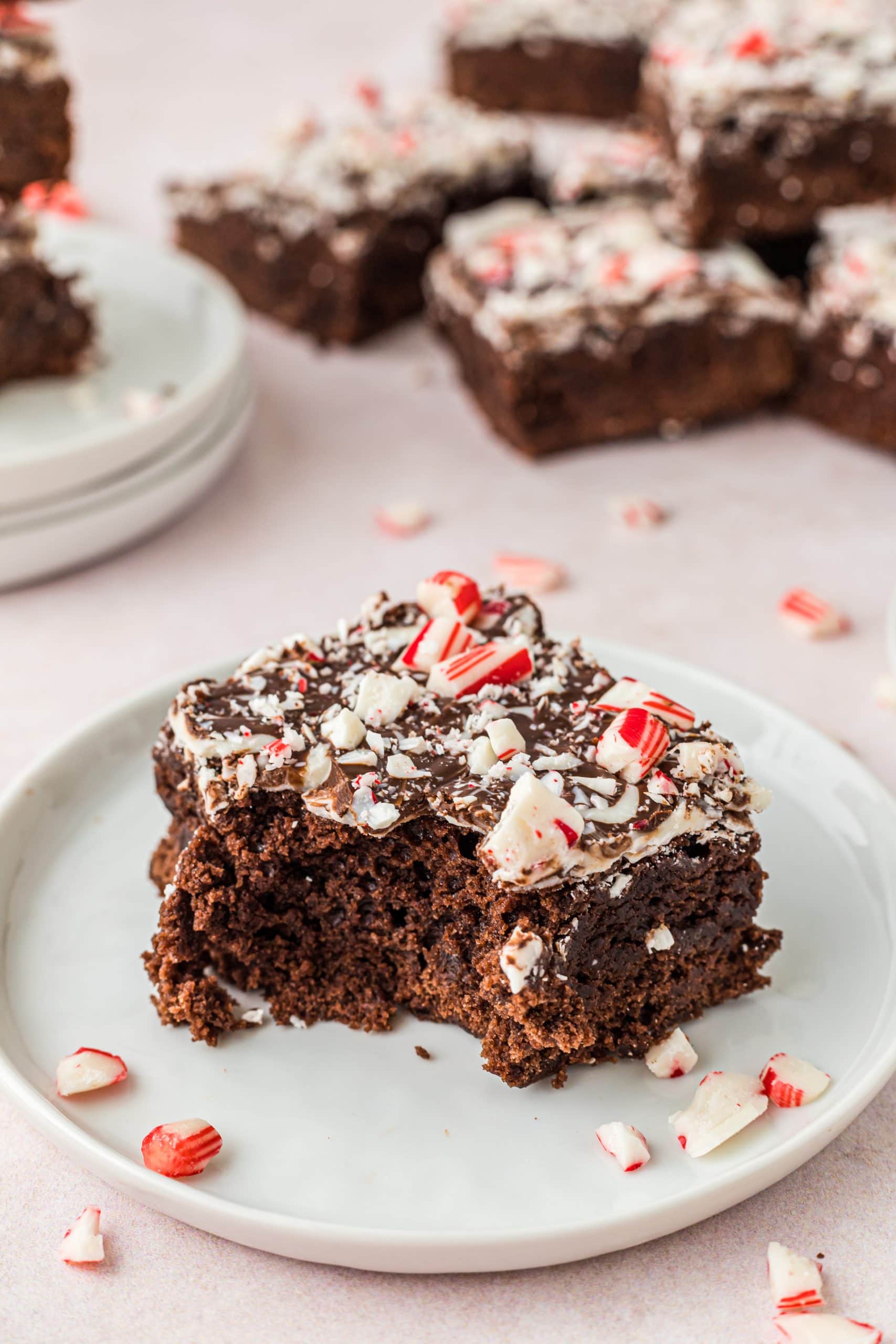 Bite in a chocolate brownie with crushed candy canes on top. 