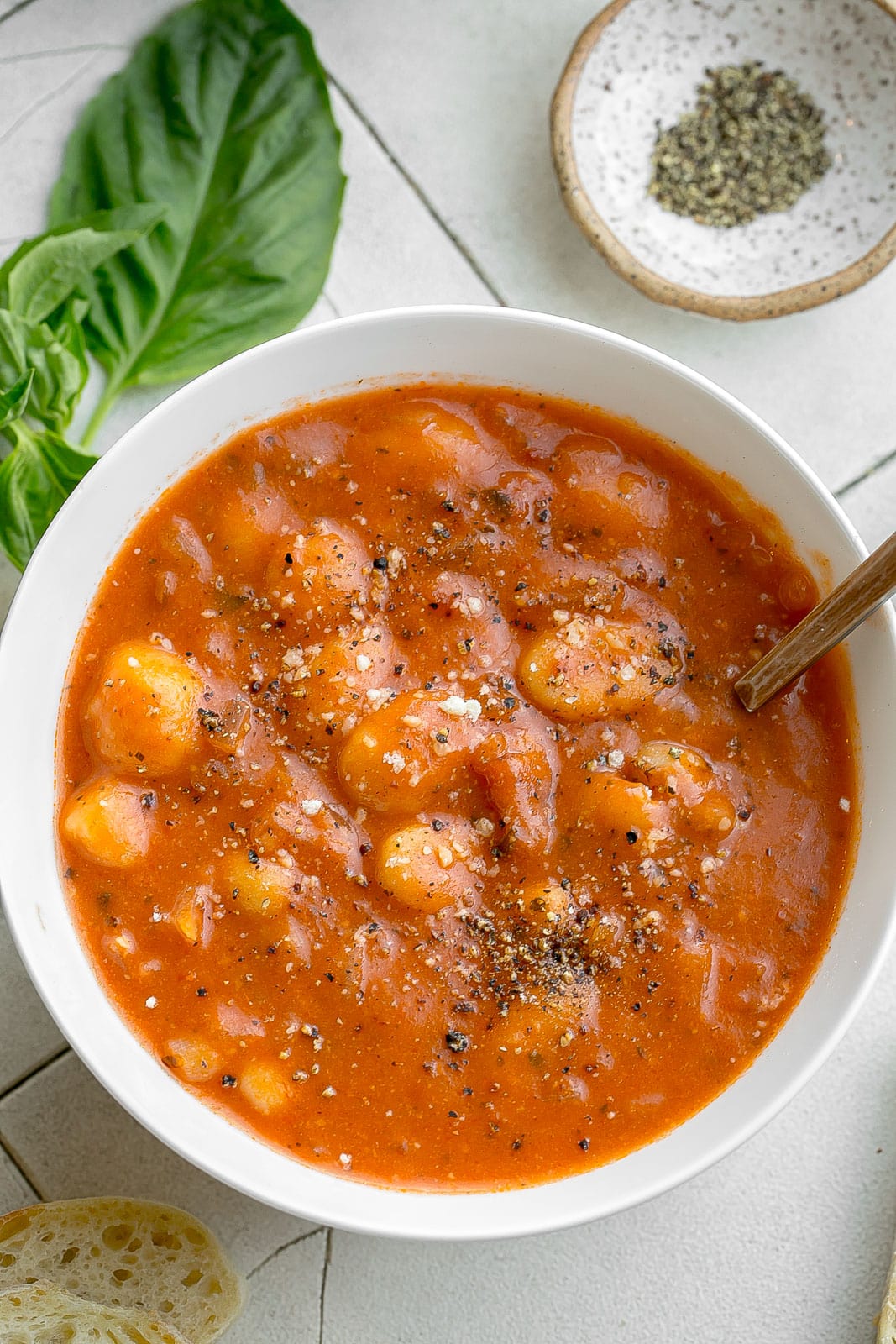 Bowl of tomato soup with gnocchi.