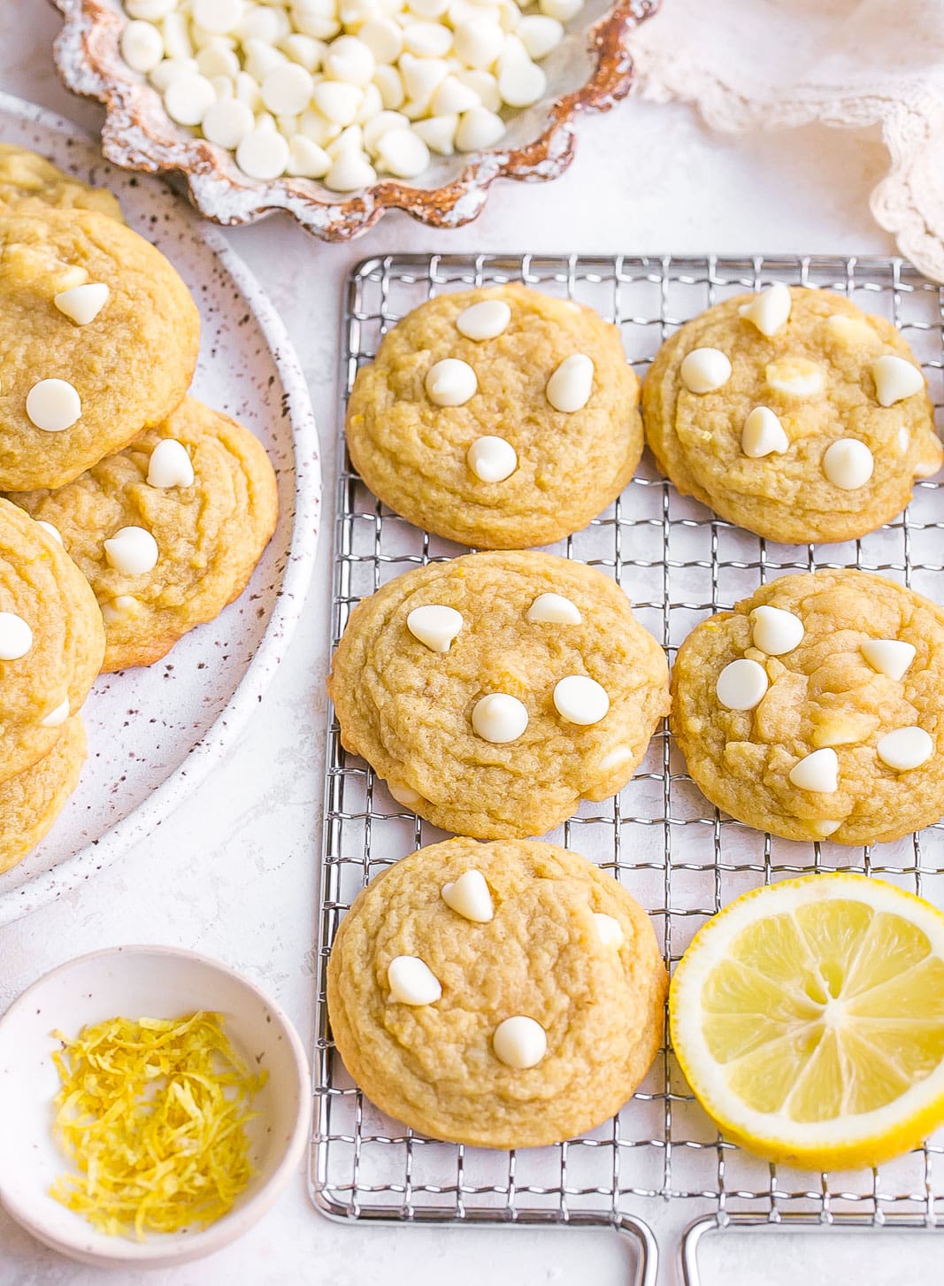 Cookies with white chocolate on cooling rack.