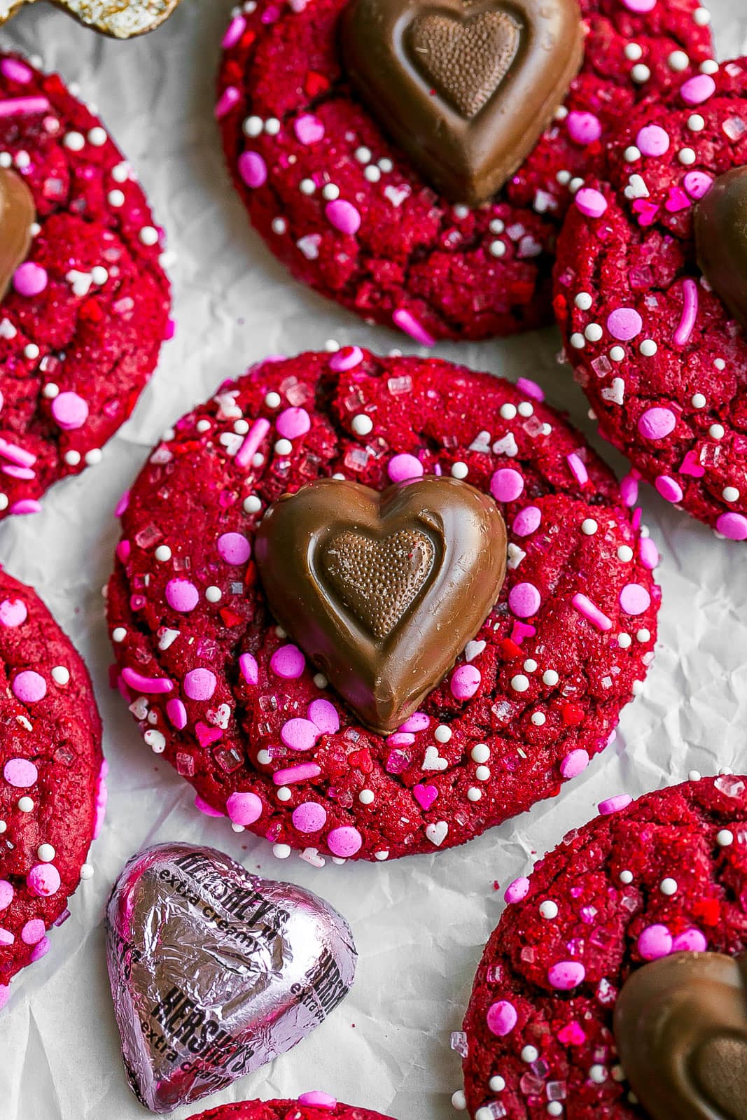 Red velvet cake mix cookie with chocolate heart in the middle.