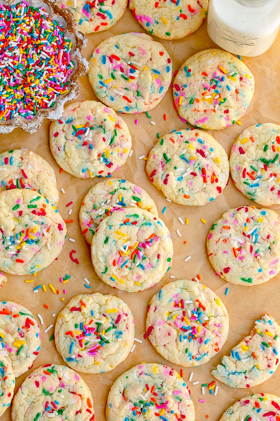 Cake mix sprinkle cookies on parchment paper.