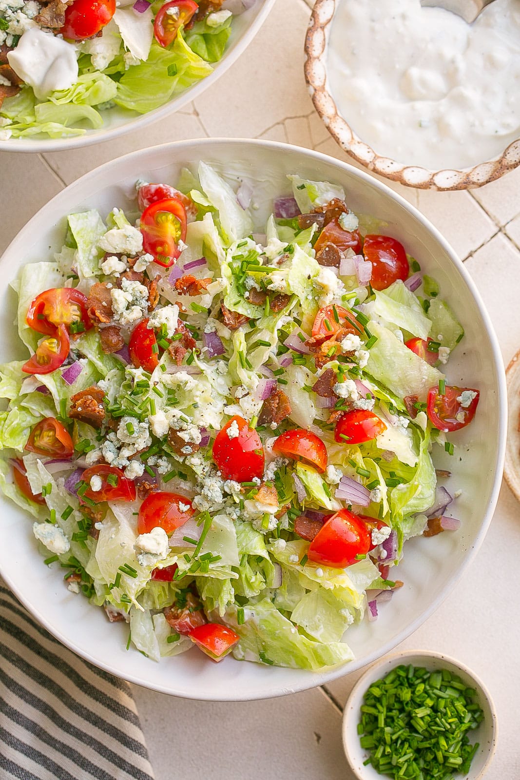 Salad with blue cheese crumbles on top.