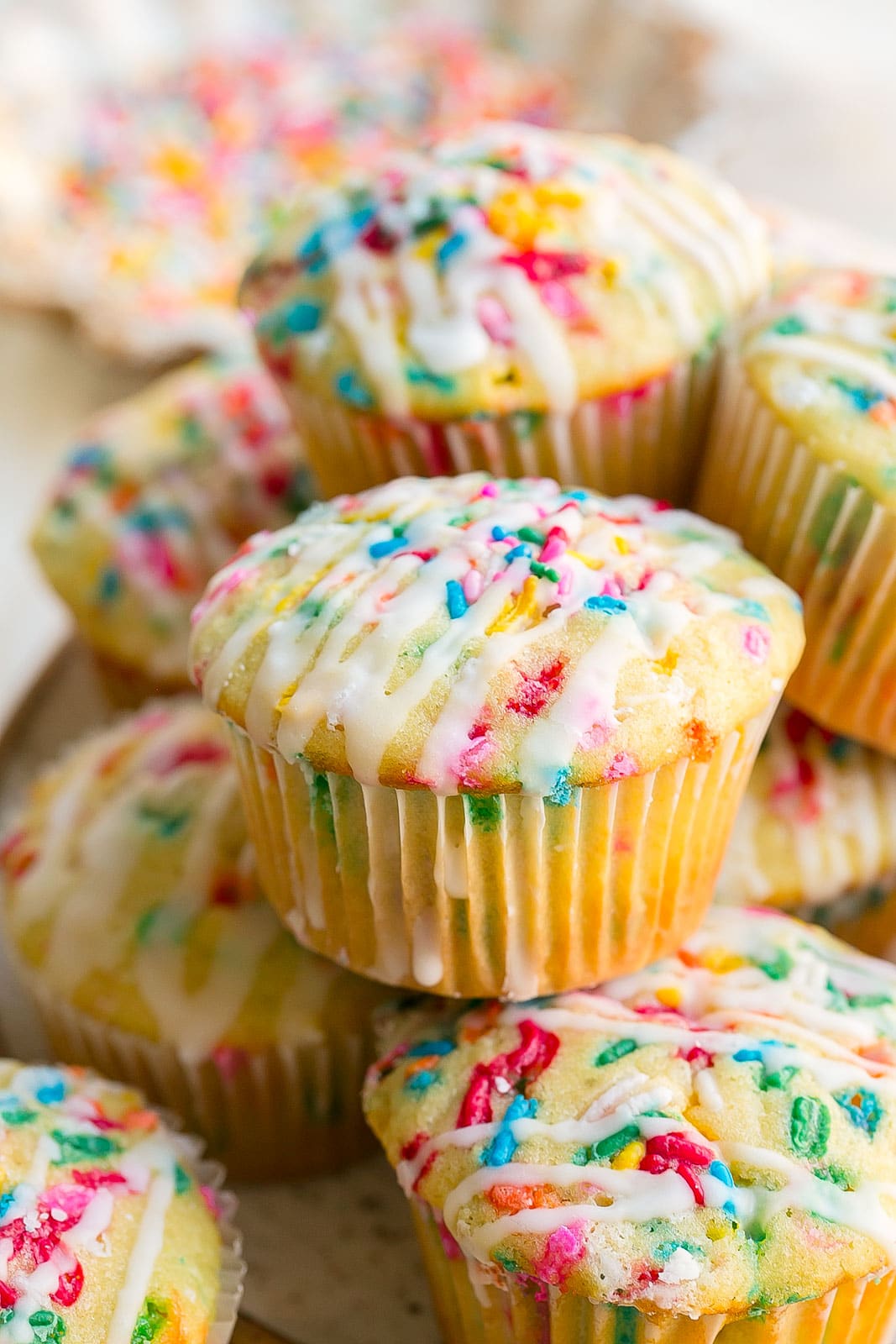 Vanilla muffins with sprinkles.